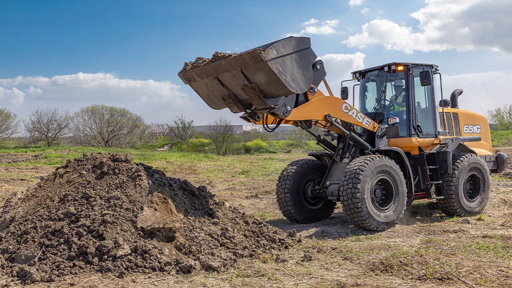 A wheel loader with its bucket elevated A wheel loader with its bucket elevated