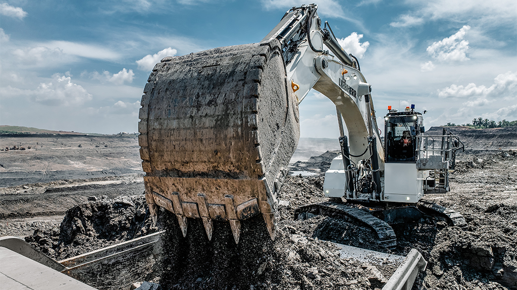 A large mining excavator uses a bucket attachment A large mining excavator uses a bucket attachment