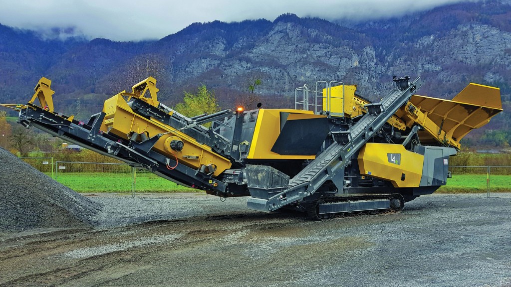 A yellow mobile impact crusher