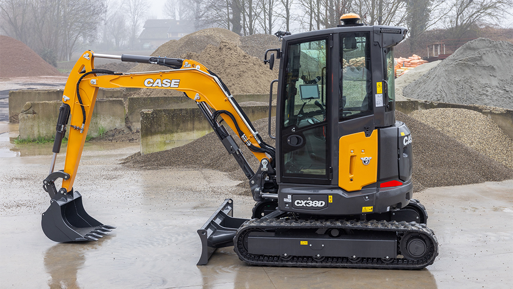 A compact excavator fitted with a bucket attachment A compact excavator fitted with a bucket attachment
