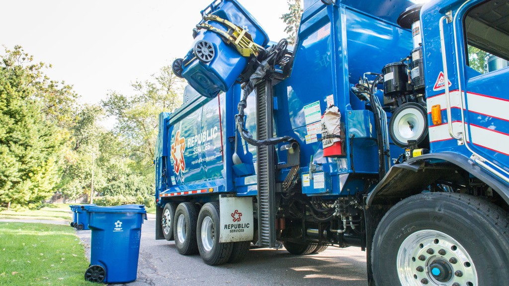 A collection refuse truck on a residential street A collection refuse truck on a residential street