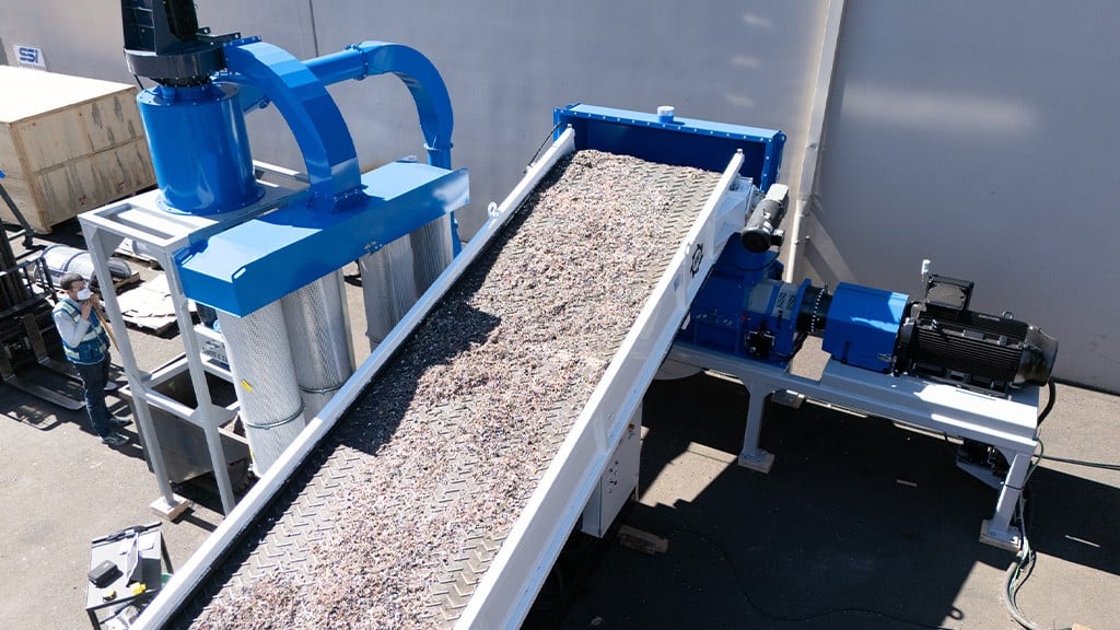A conveyor belt with an array of mixed materials in fine particles A conveyor belt with an array of mixed materials in fine particles