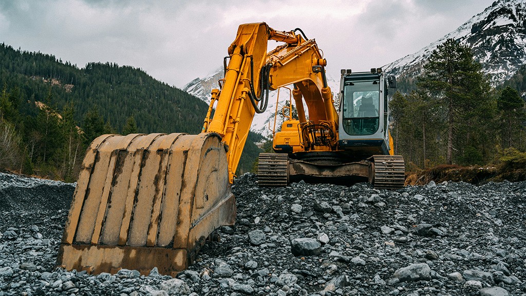 An excavator with a bucket attachment An excavator with a bucket attachment