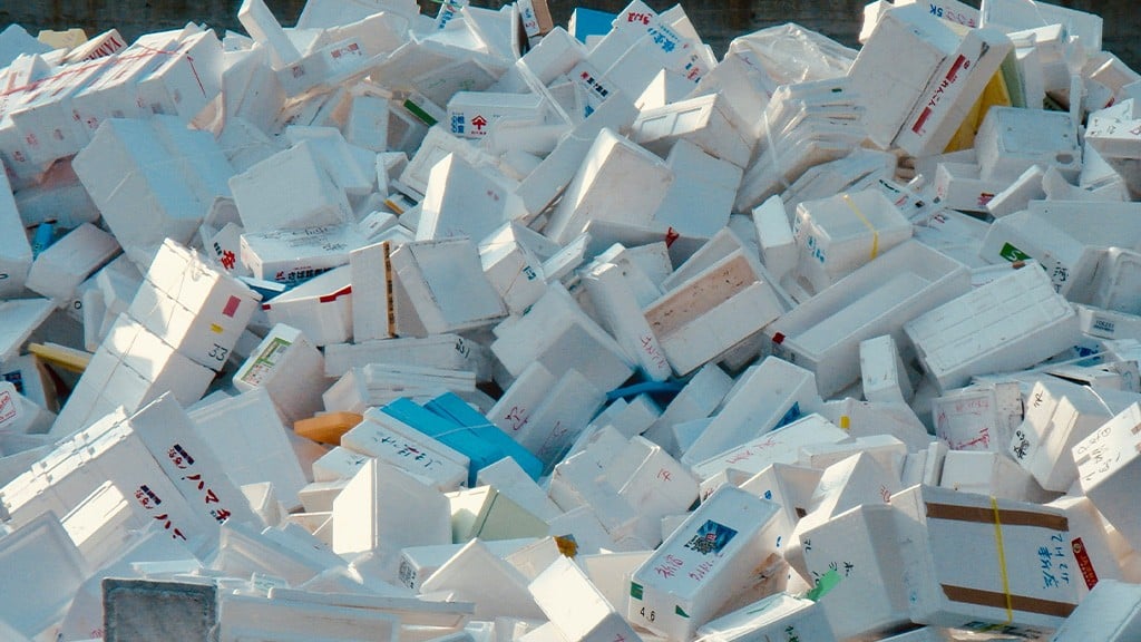 A large pile of mixed and used expanded polystyrene packages A large pile of mixed and used expanded polystyrene packages