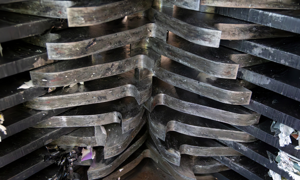 The metal teeth of a shredder