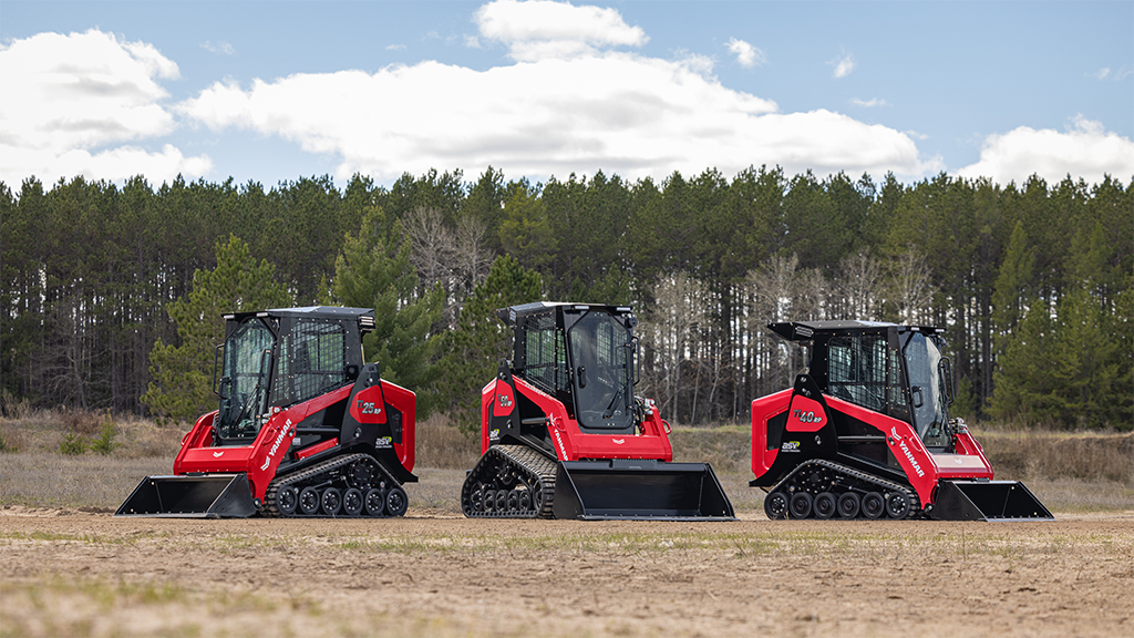 Three compact track loaders lined up Three compact track loaders lined up