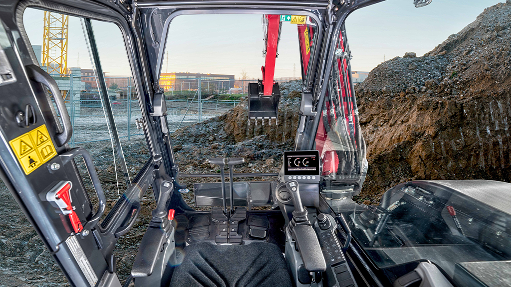The interior of the cab of a mini excavator The interior of the cab of a mini excavator