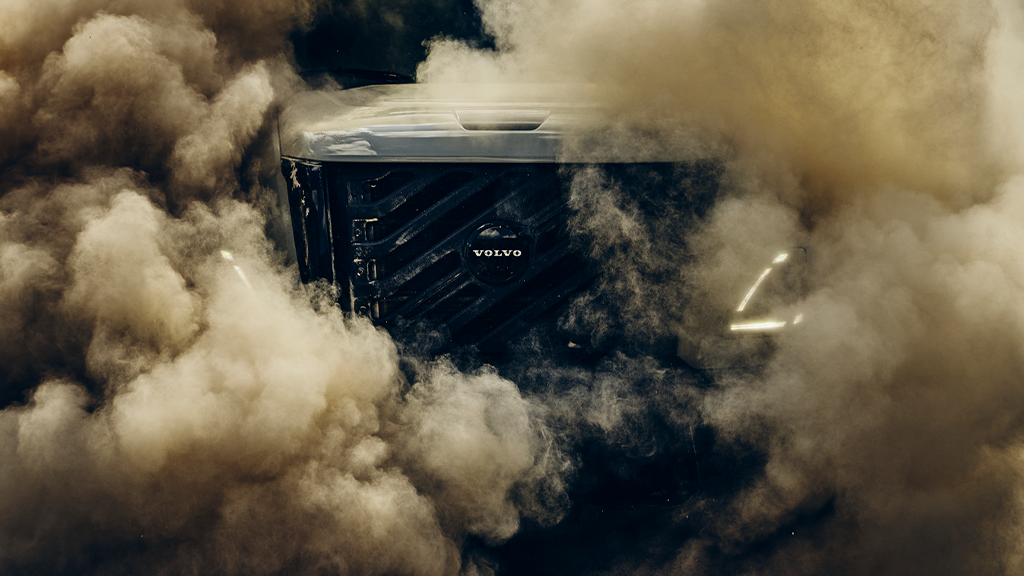 The front grill of a vocational truck obscured by smoke The front grill of a vocational truck obscured by smoke