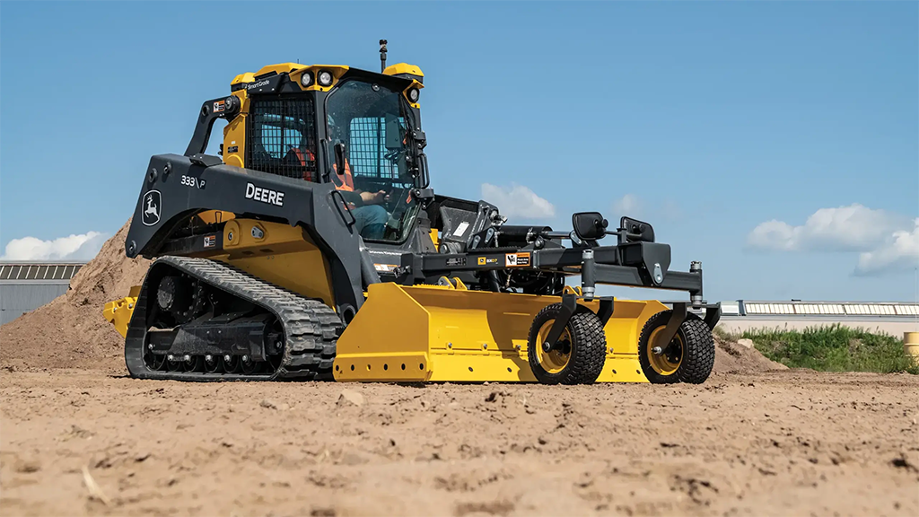 A large-frame CTL with a box blade grading attachment A large-frame CTL with a box blade grading attachment