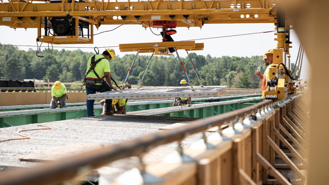 Bid-Well's MT Behemoth precisely moves materials for bridge construction