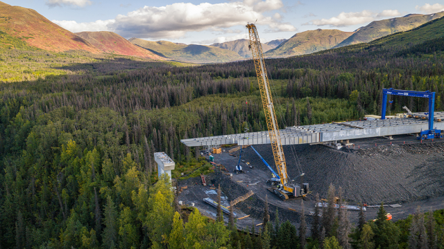 Two Liebherr crawler cranes lift and position bridge in Alaska to connect remote peninsula